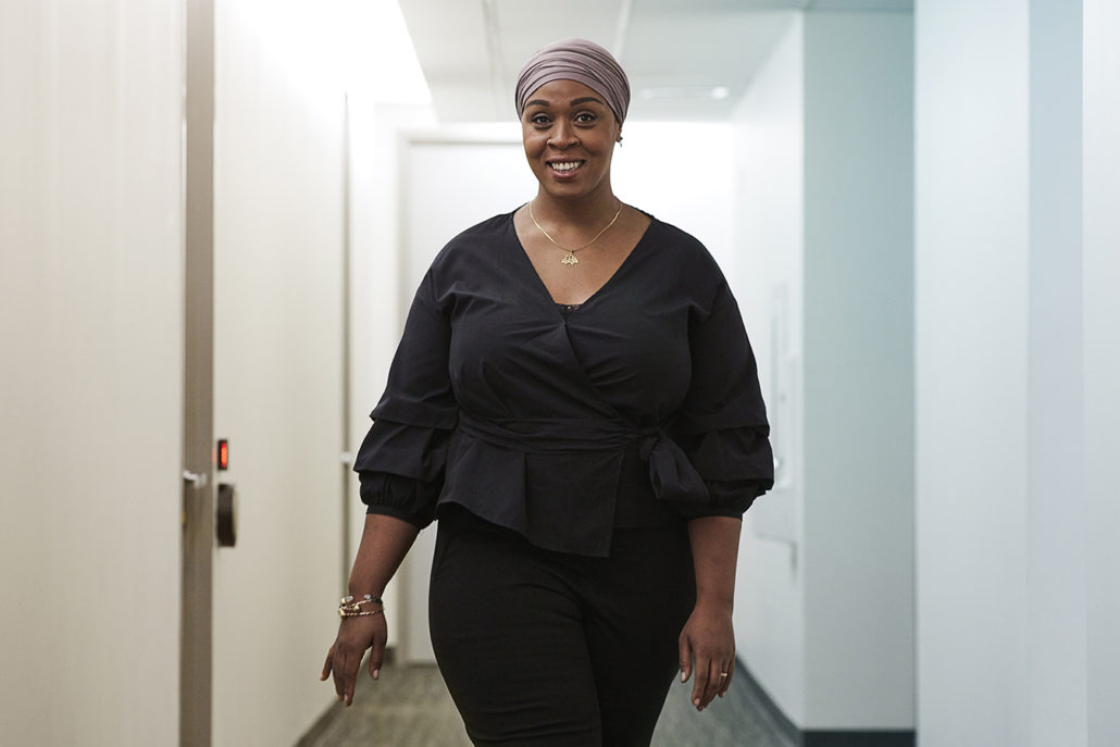 Dr. Fatimah Jackson-Best walks down a hallway
