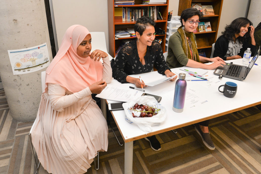 Sureya engaging in a staff meeting