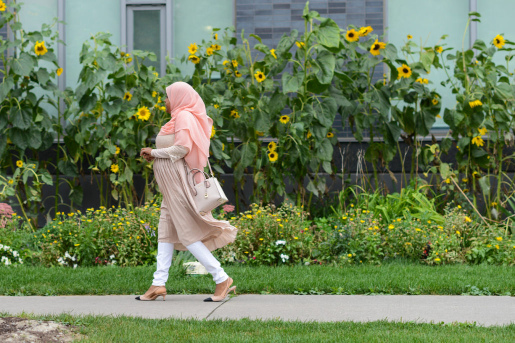Sureya walking on a sidewalk