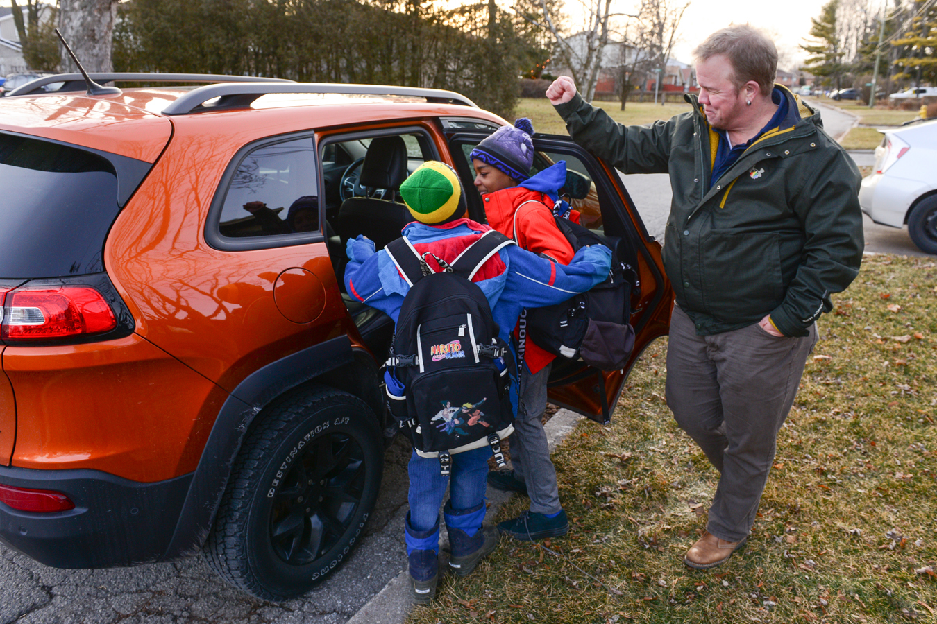 Children getting into a car