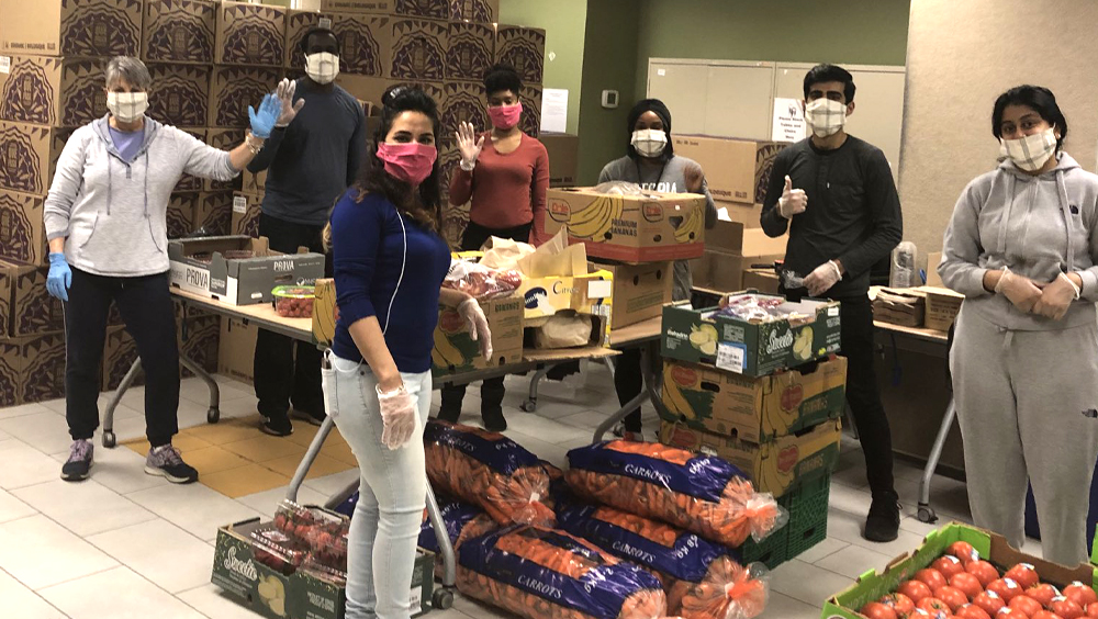 Agency workers and volunteers collecting food for donation.