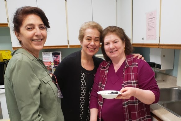 Three people volunteering at a United Way-supported food security program