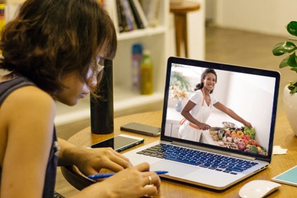 Someone on a computer learning about food security