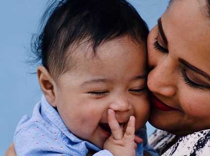 Woman hugging child