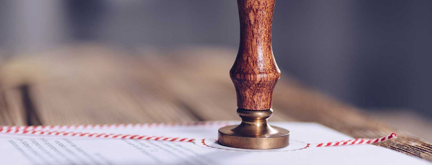 A wooden stamp on a document