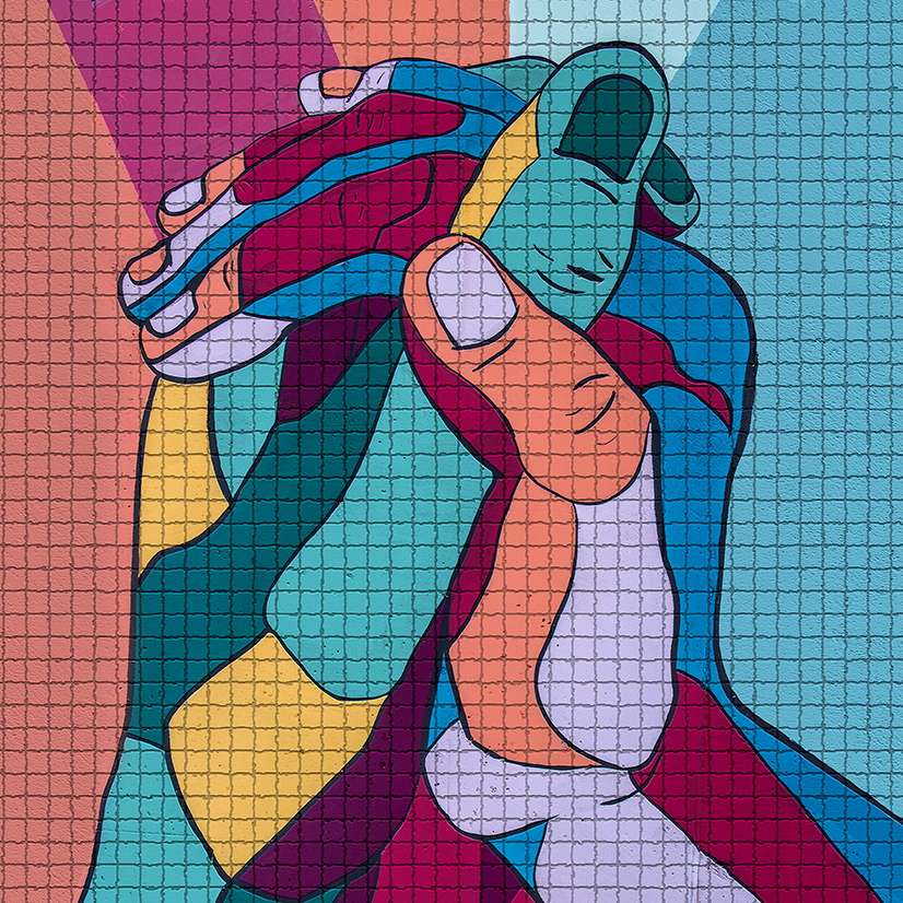 Wall mosaic of hands clasping.