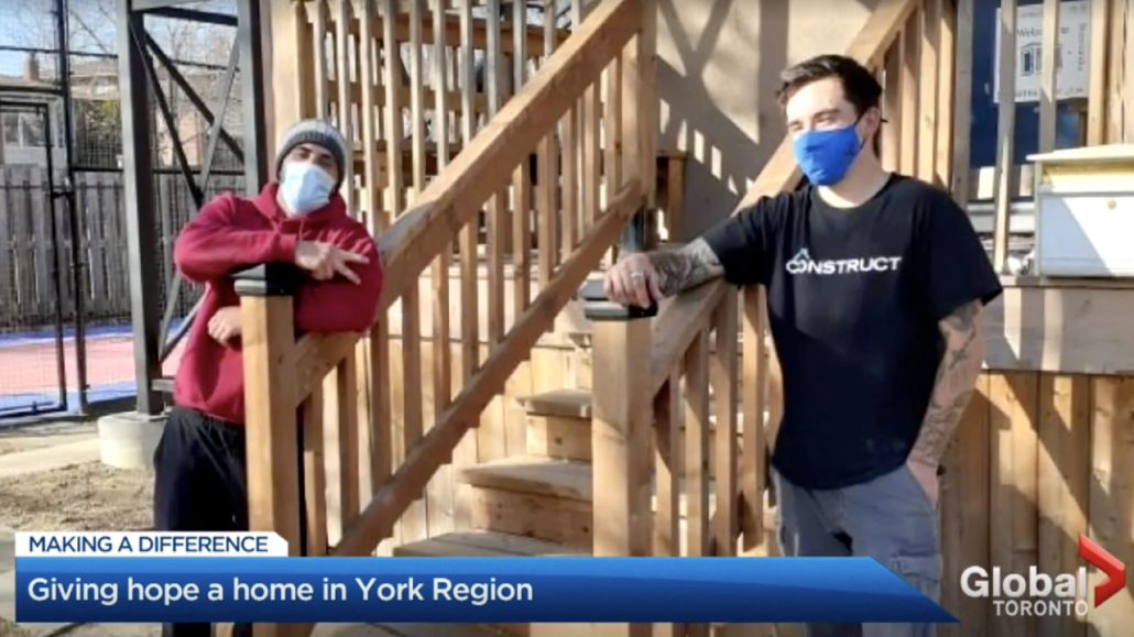 Screenshot of Global News Story, featuring two Construct participants in front of a newly built house. The News tagline reads 'Giving hope a home in York Region.'