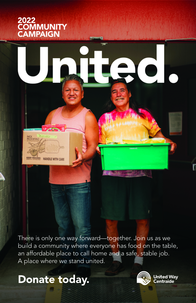 National Campaign Poster with two people smiling and holding food boxes.