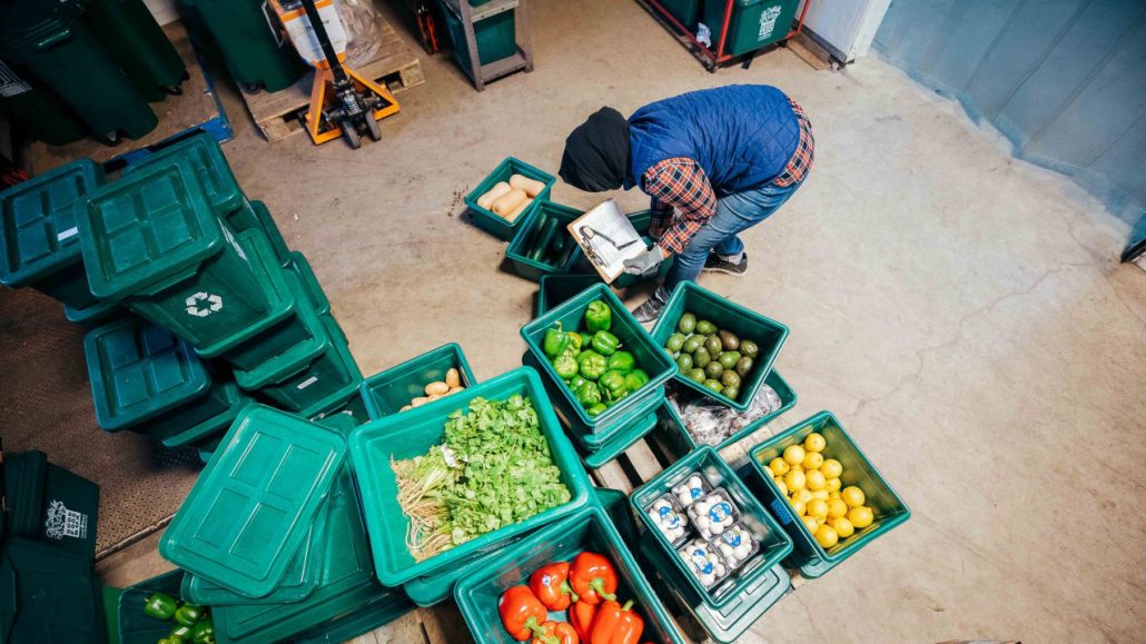 A FoodShare employee assembles food boxes in a warehouse. The agency is one of the organizations tackling rising food insecurity in the GTA. 