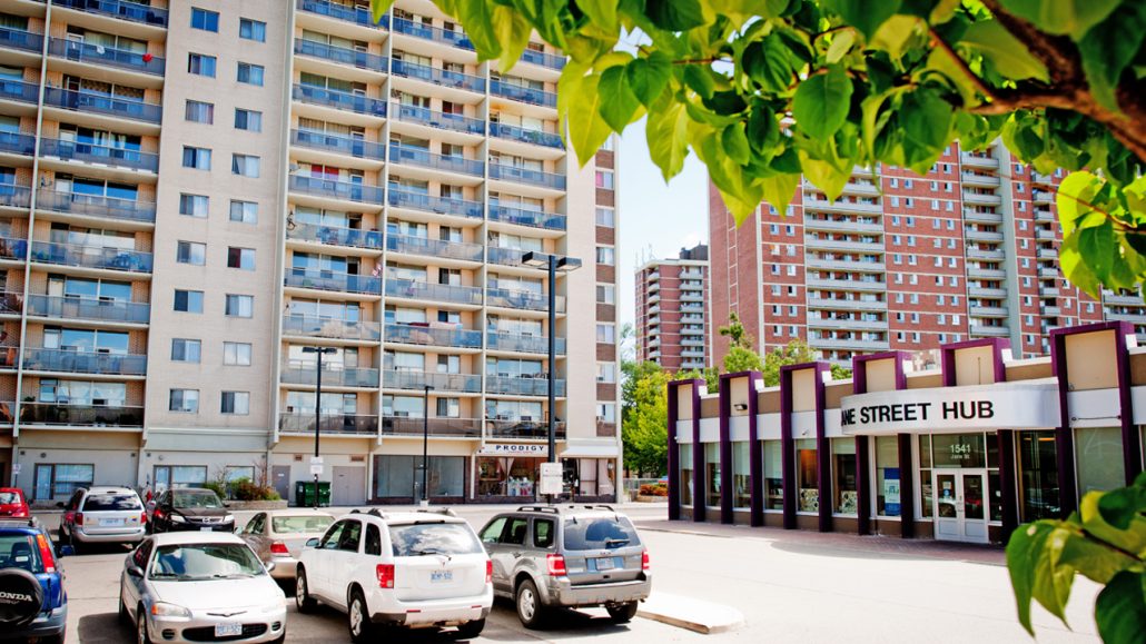 Exterior of the Jane Street Hub with high rise buildings in the background