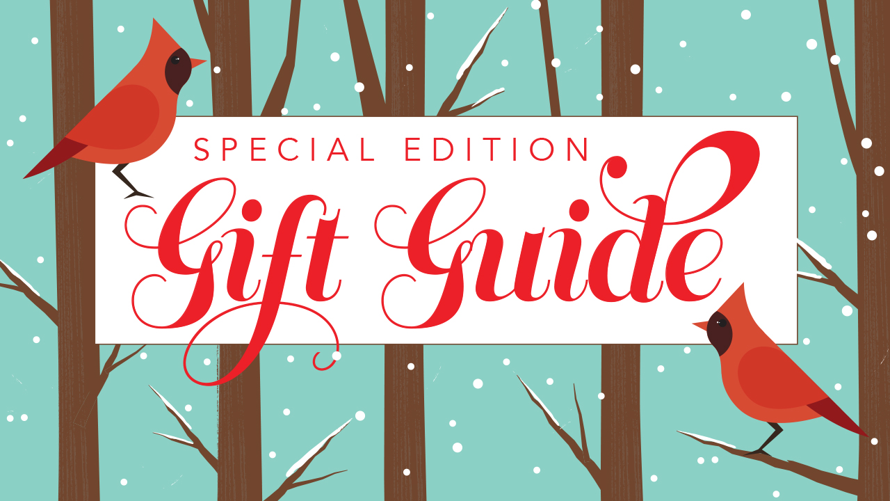Illustration of two cardinals perched on trees in a winter landscape. Copy over the image: Special Edition Gift Guide.