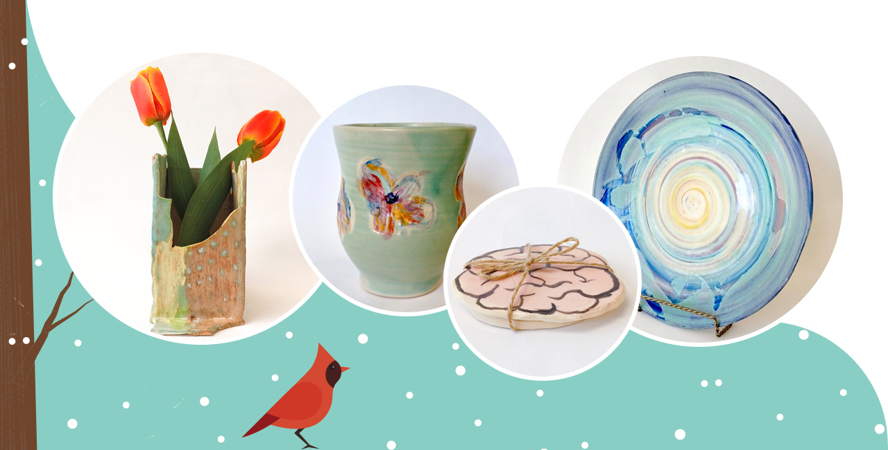 Selection of pottery from Inspirations Studio Pottery Shop, including a base, a mug with flowers on it, coaster with a cartoon brain painted on it, and a large blue platter. 