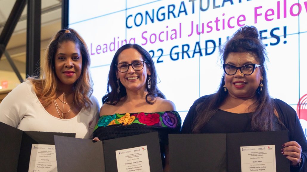 Three Leading Social Justice Collective pose at the 2022 graduation ceremony