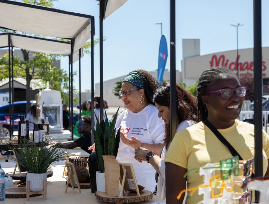 Residents of the Golden Mile area wall amongst vendor stalls at the ILEO pop-up market.