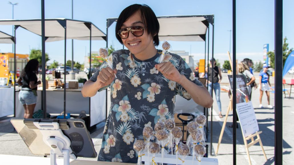 A vendor selling products at a booth