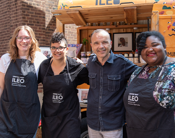 United Way Greater Toronto President and CEO Daniele Zanotti with three entrepreneurs at the ILEO Community Storefront in the Distillery District.