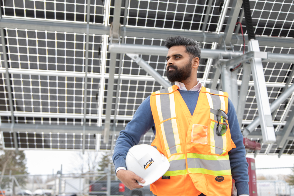 Syed Jafri, one of the first employees of the community-based construction company A-GM, holding white hardhat under his arm.