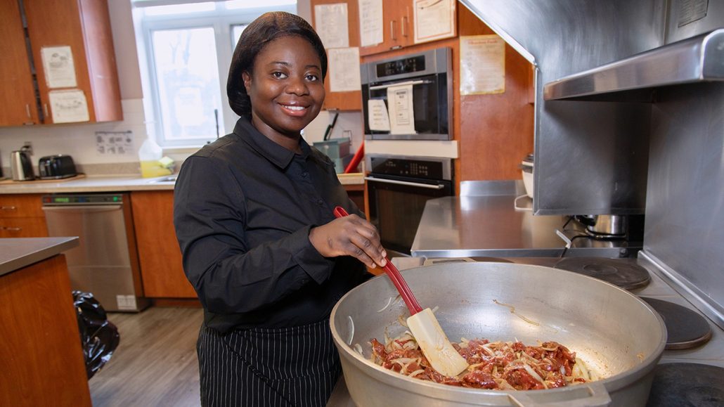 Francisca cooking in a kitchen