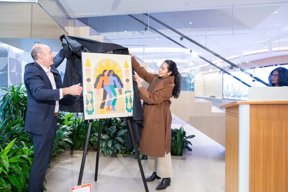 Local artist Sarah Alinia Ziazi joins PwC Canada’s CEO Nicolas Marcoux in unveiling her commissioned art.