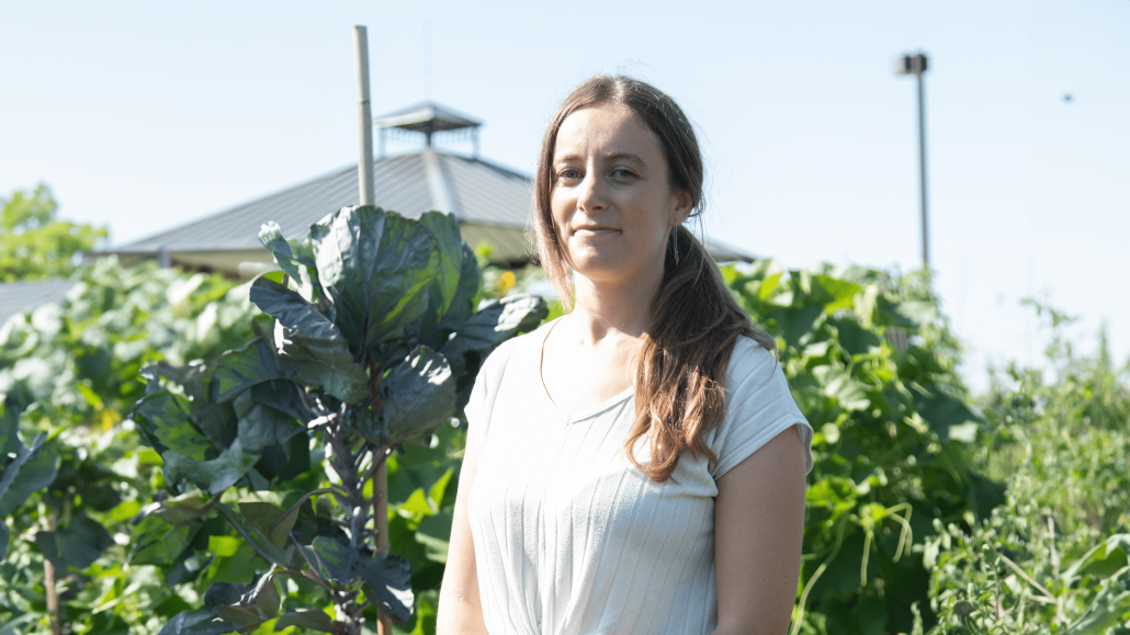 Britt standing in a garden