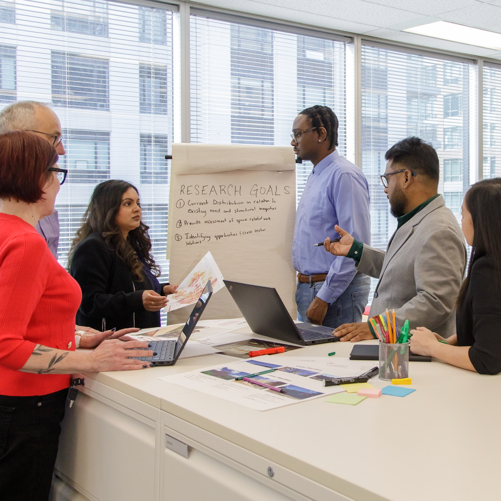 People looking at a whiteboard