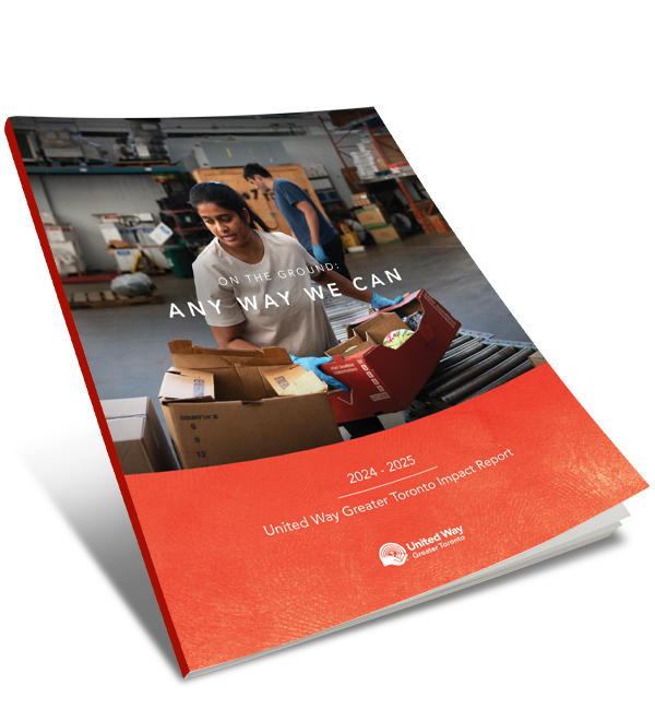 A copy of United Way Greater Toronto’s 2024-2025 Annual Report, titled “On the ground. Any way we can.” The cover has an image of workers preparing grocery boxes. 