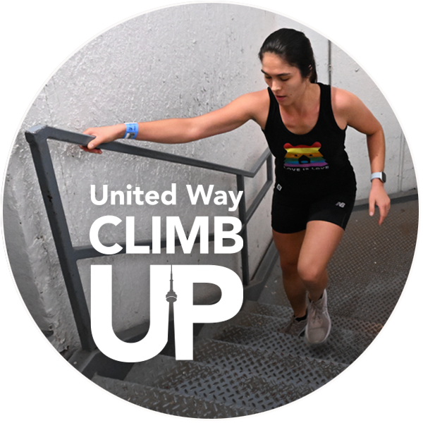 A woman wearing athletic clothes climbs a metal staircase in the CN Tower at United Way ClimbUP.