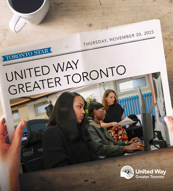 Person holding the Toronto Star Newspaper