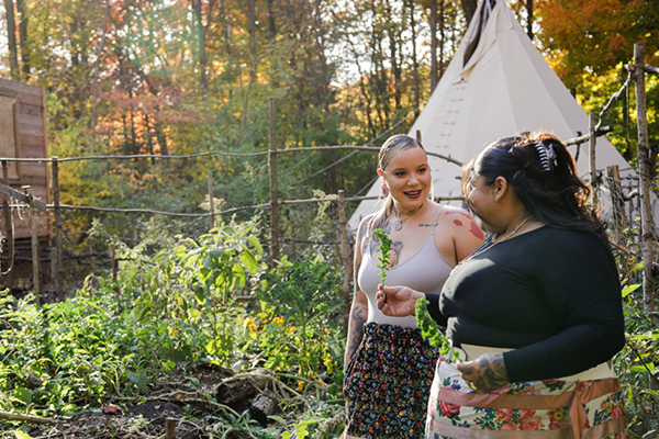 Two women walking in the woods