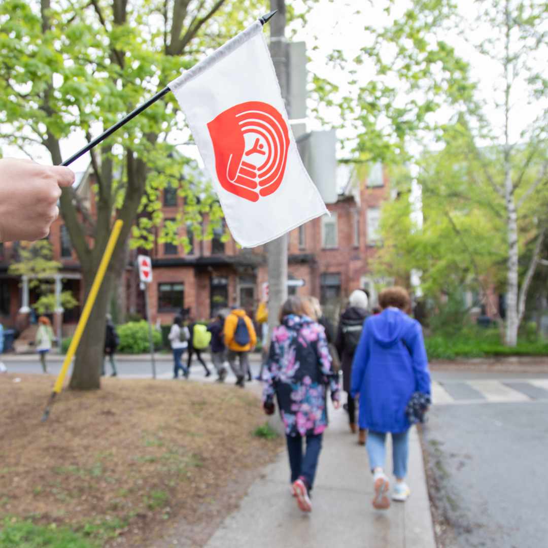 People walking through Toronto neighbourhood
