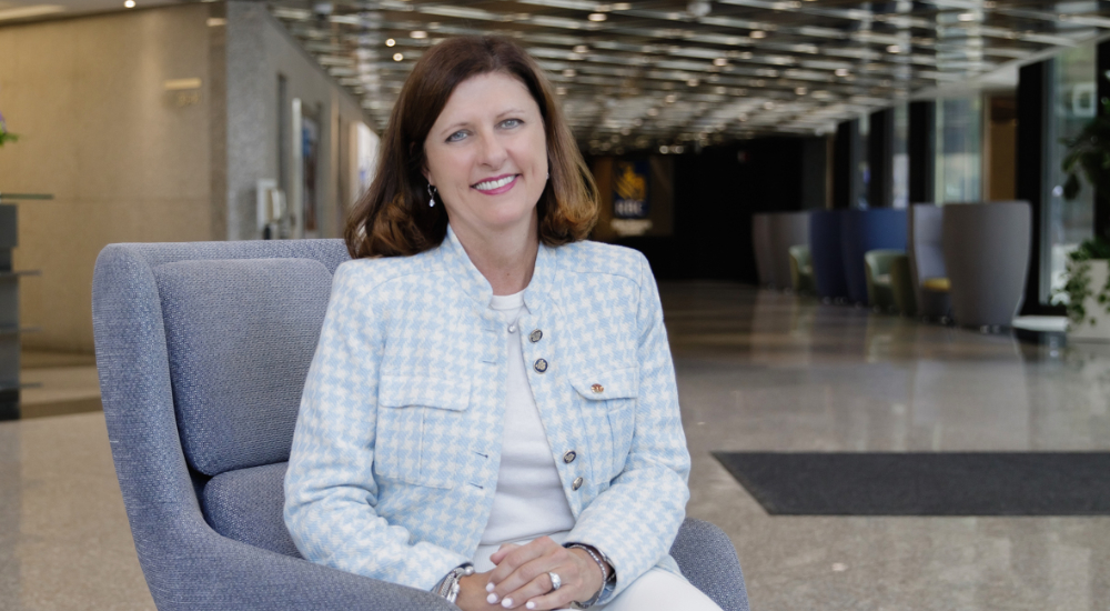 Patti Shugart sitting in foyer of building