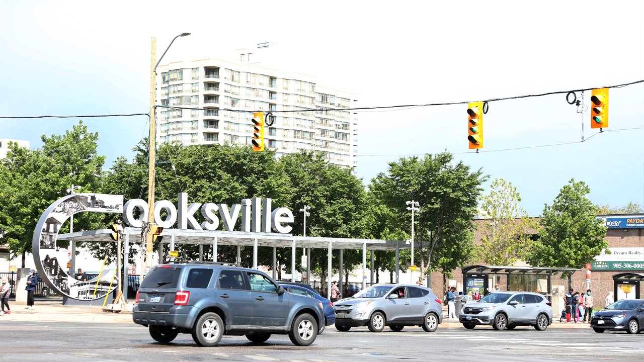 An intersection in Cooksville with a sign of the name of the neighbourhood