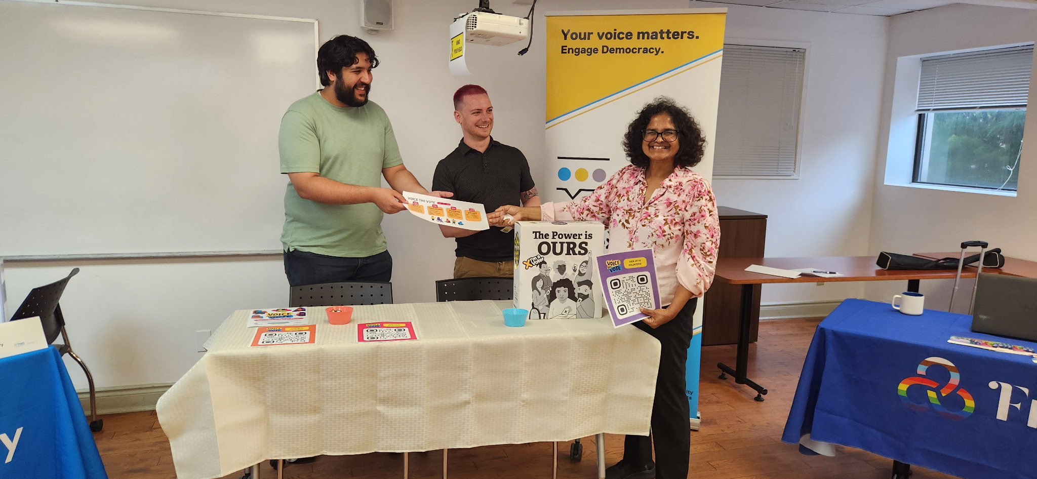 People standing at a Voice the Vote booth