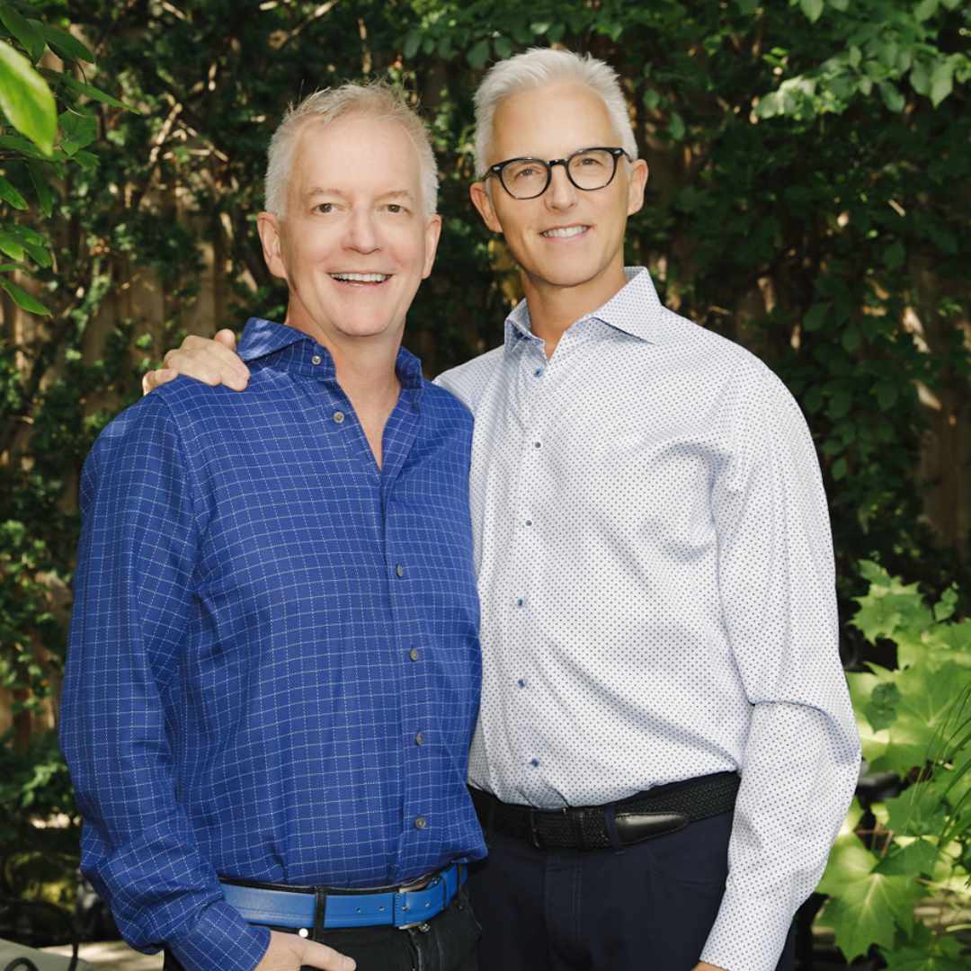 Portrait of Brad and Brian outside in a garden